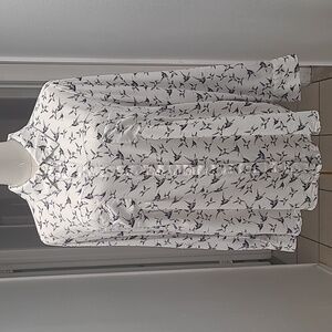 Cute blouse with nice off white and navy design, very soft, gently worn